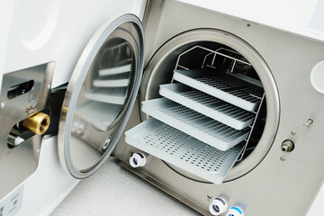 Medical autoclave close-up without tools. A sterilizer that processes tools using steam, which is supplied under pressure.