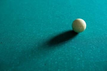 Playing billiard. Billiard white ball on green billiards table. Billiard sport concept. Pool billiard game.