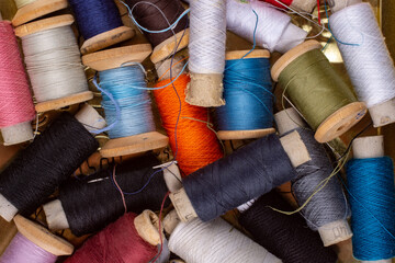 Many colorful skeins of thread close up.