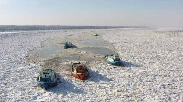 Icebreaker ships crushing ice on Vistula river, Plock, 2021-02-21, Poland