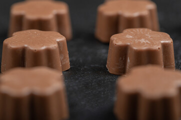 Some of chocolate candies on a dark background