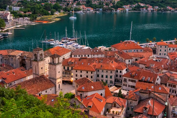 Red roof houses and boats on the Adriatic coast in the Bay of Kotor, Montenegro