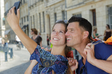 couple during selfie after shopping