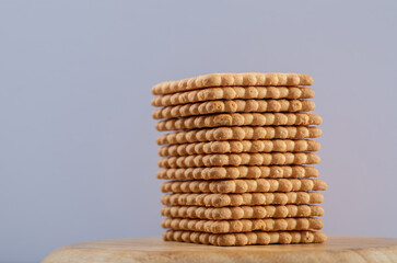Many of delicious fresh crackers on a wooden board