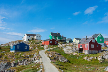 Greenland. Itilleq. Road leading through colorful houses. © Danita Delimont