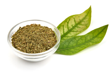 Dried basil herb, crushed basil, isolated on white background. High resolution image