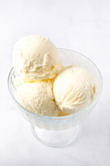 Vanilla Ice Cream Scoops with raspberries and chocolate sticks, easy dessert at home