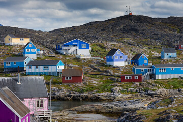 Greenland. Itilleq. Colorful houses dot the hillside.