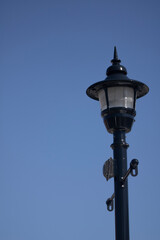 Fototapeta na wymiar Old lamp on the road