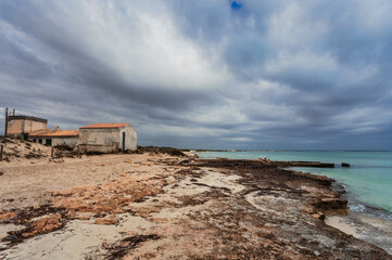 Es Trenc beach under dramatic gloomy sky. Mallorca island