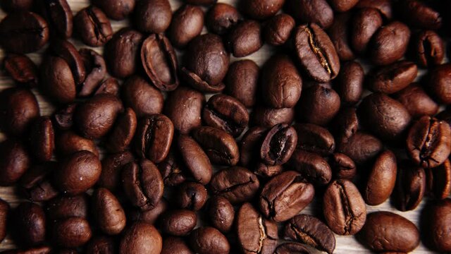 Flat ley close-up of a set of coffee beans. The concept of everyday coffee drinking. Coffee beans for background