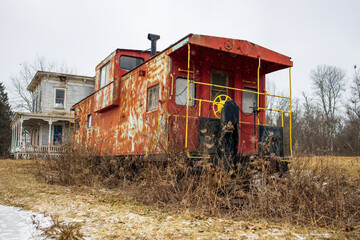 Obraz premium Faded Caboose on Route 7 in Colliersville, NY