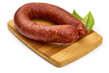 Smoked pork sausage ring, isolated on white background. High resolution image.