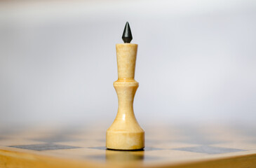 Chess piece white king on a chessboard, close-up. Leadership and victory concept