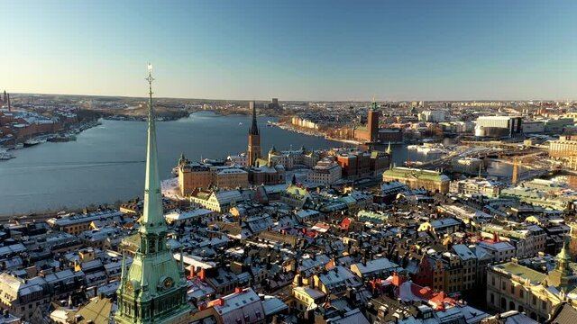 Rising aerial drone fottage of Stockholm City and Old Town during a beautiful winter day. Awesome view of the Swedish Capital.