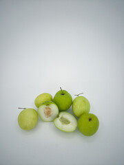 Indian jujube fruit or Ziziphus mauritiana or buah bidara in a rattan bowl. Blurred background