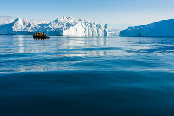 Greenland. Ilulissat. Zodiac cruising among the icebergs in the Icefjord.