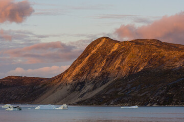 Greenland. Disko Bay. Sunset on the arid coastline of Greenland.