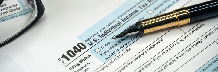 Tax form USA business income office concept. Tax Return Form 1040, wide banner