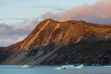 Greenland. Disko Bay. Sunset on the arid coastline of Greenland.
