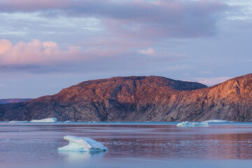 Greenland. Disko Bay. Sunset on the arid coastline of Greenland.