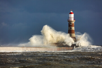 Image of a Lighthouse during a storm at Sunderland, Tyne and Wear, England, UK.