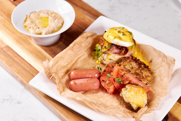 English Breakfast or Lunch in Restaurant Flat Lay, Sausages, porridge and Vegetables on plate, top view