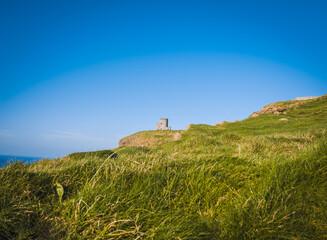 Fototapeta na wymiar castle on hill of cliffs of moher