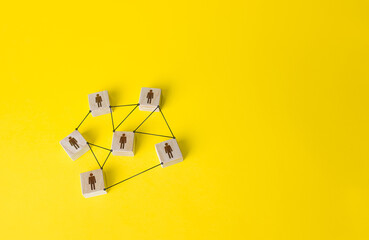 Connected people figures form a working team network. Cooperation and division of responsibilities...