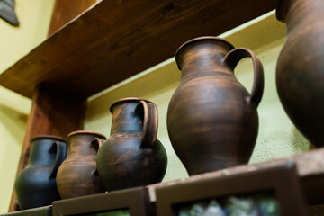 Handycraft clay brown tableware, earthenware jug in pottery workshop. Ceramics product concept.