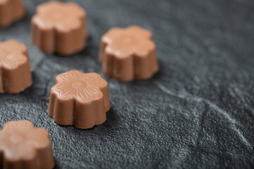 Some of chocolate candies on a dark background