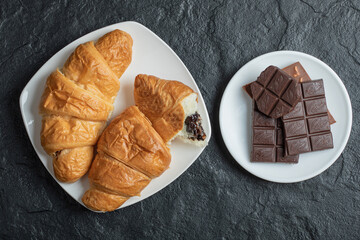 Croissants with chocolate filling on a dark background