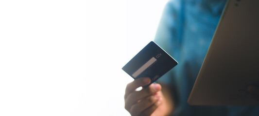 Hand holding a credit card, Payment for Shopping online.