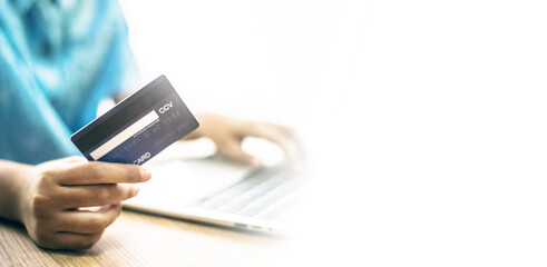 Hand holding a credit card, Payment for Shopping online.