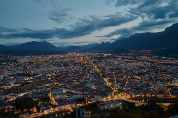 Beautiful views over the illuminated streets of Grenoble from the Bastille fortress. 
