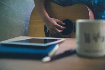 Musicians play guitar and compose songs.