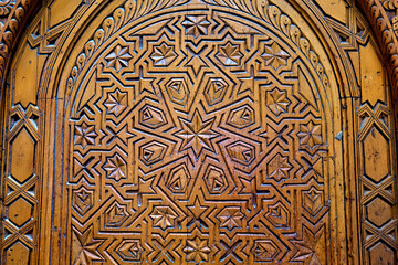 Details view of the decoration of one of the wooden doors in Fez Medina quarter in Morocco.