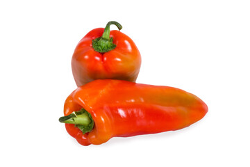 Two bulgarian sweet bell peppers on white wooden background.