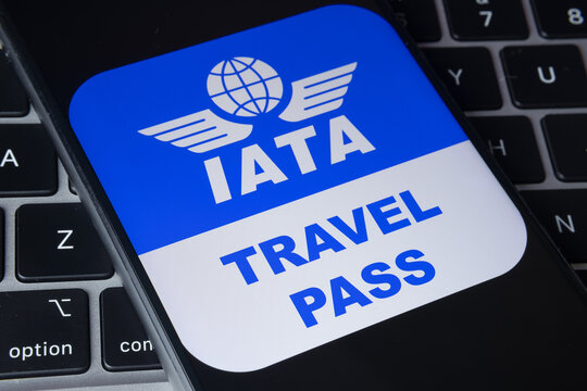 IATA logo with Travel Pass letters next to it seen on the screen of the smartphone.  Stafford, United Kingdom, February 23, 2021. Stafford, United Kingdom, February 23, 2021.