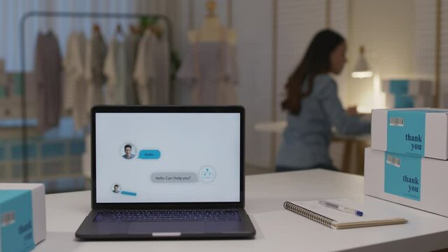 Chatbot conversation on laptop screen app interface with artificial intelligence technology providing virtual robotic assistant customer support and information for small business SME B2C concept.