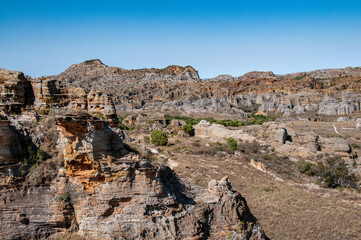 Fototapeta premium The characteristic rock formations of the Isalo N.P. they are crossed by paths that are often tiring for the great heat