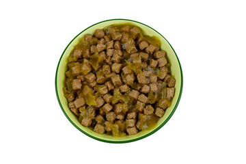 Canned food for cats or dogs in ceramic green bowl isolated on white background. Top view