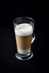  Coffee with milk on dark background. Copy space.