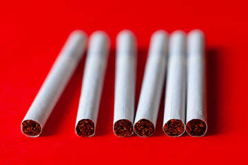 Cigarettes at red . Unhealthy Lifestyle . Tobacco products