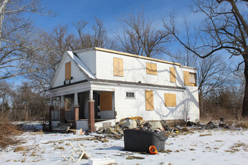 Abandoned and board-up home in Brightmoor in Detroit in winter