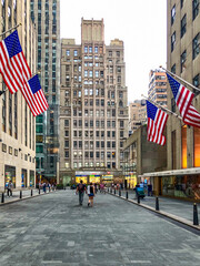 American Flag flying in Rockefeller Plaza in Manhattan New York