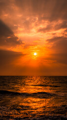 Fototapeta premium sunset over the sea with god rays