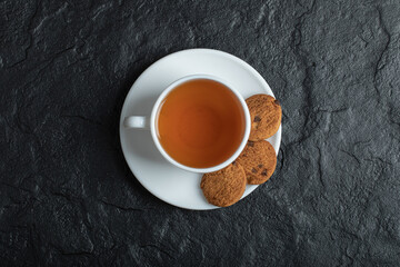 A cup of aroma tea with delicious cookies