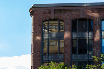 City brick building with blue sky