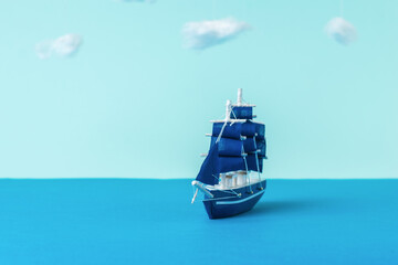 Installation of a sailboat in the sea against a cloudy sky.
